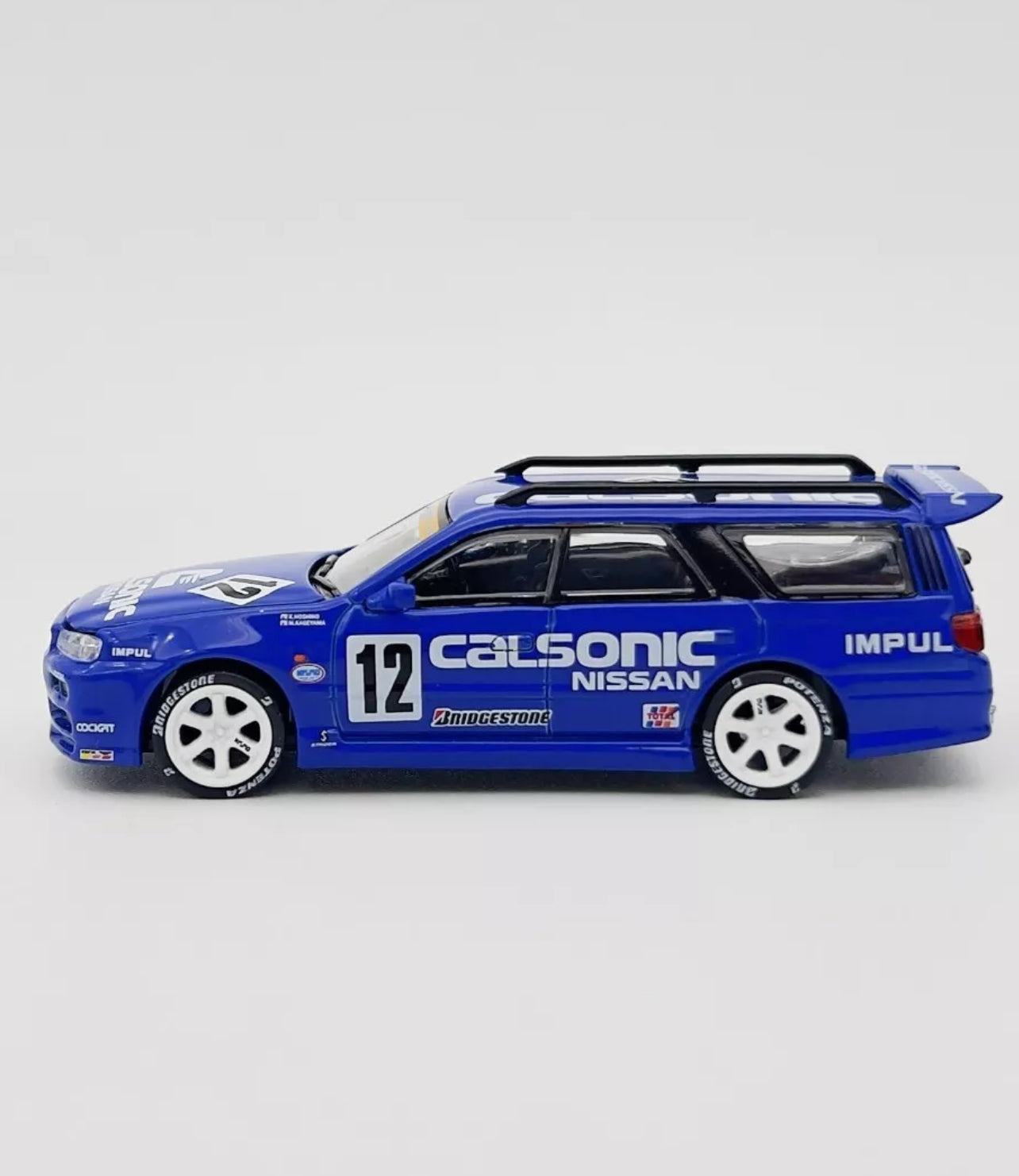 Pop Race 1:64 Nissan Stagea R34 Wagon Calsonic #12 Blue PR64-59